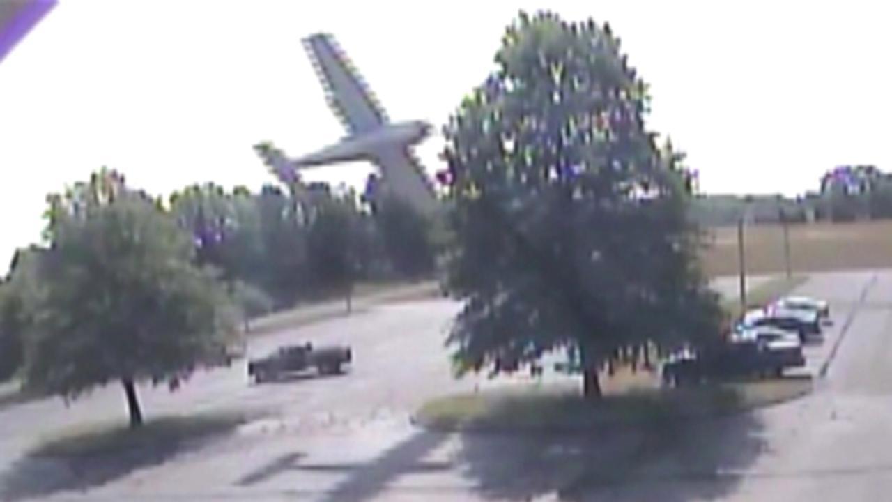Plane hits tree, crashes into parking lot shocking onlookers
