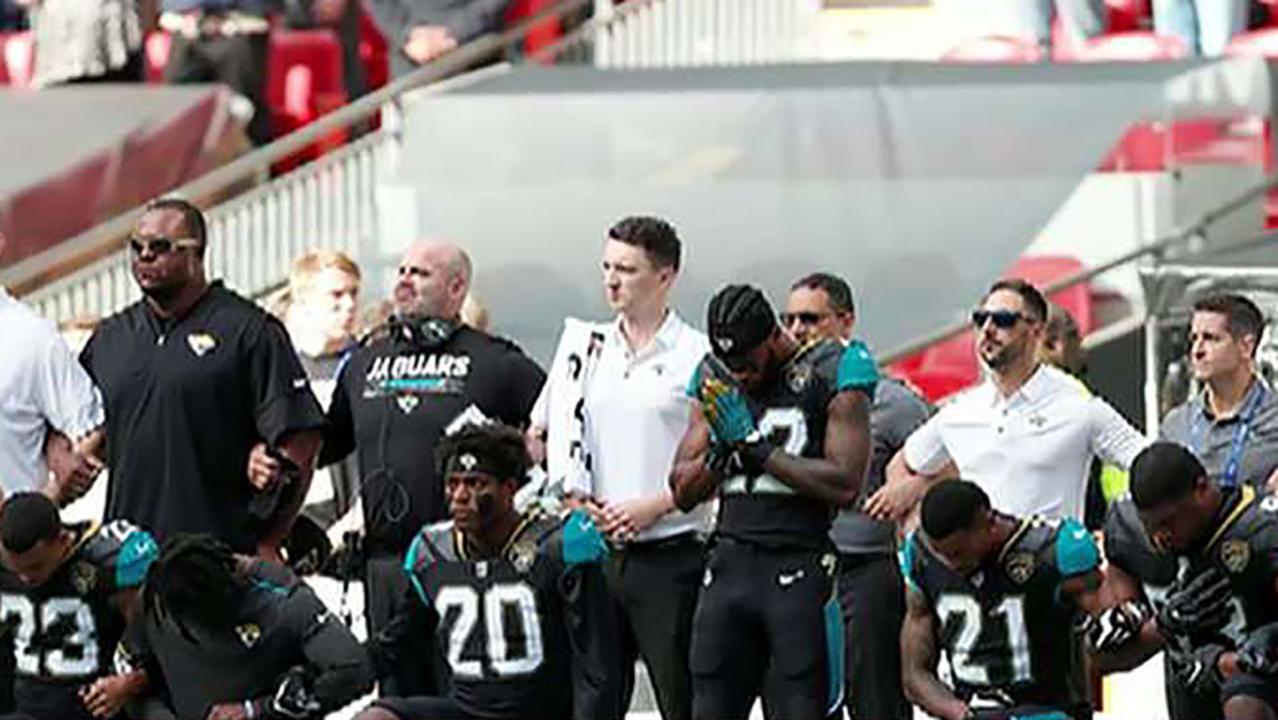 Ravens and Jaguars Players Kneel and Lock Arms During National Anthem