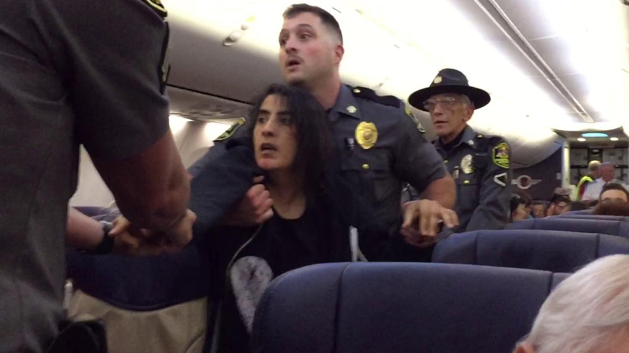 Southwest apologizes after cops remove woman from flight