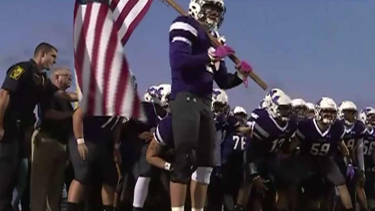 Illinois high school football team honors first responders