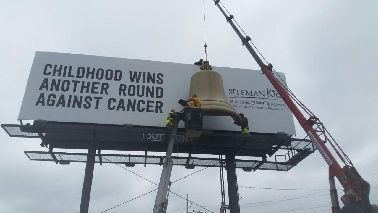 Billboard with chemo bell rings when child ends treatment