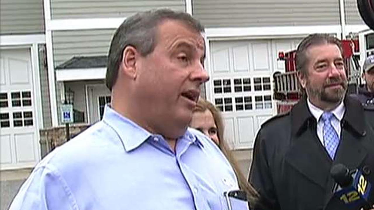 Christie argues with a voter at a polling station