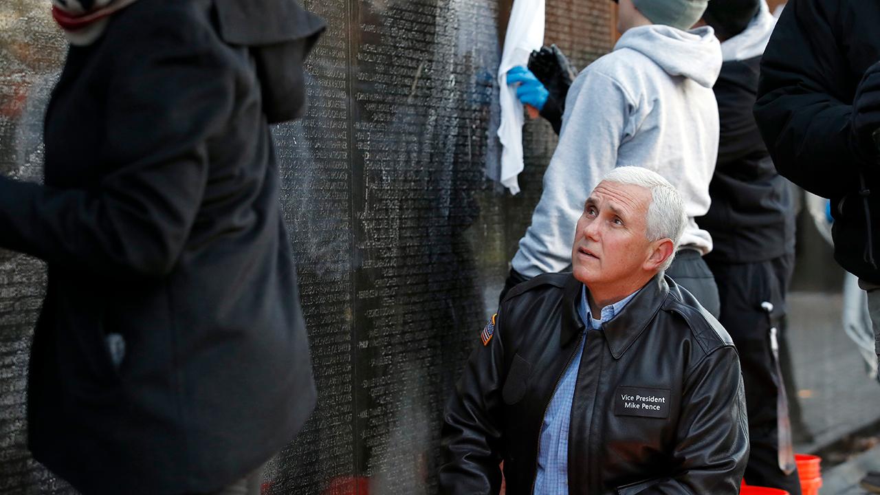 Pence helps clean Vietnam Veterans Memorial