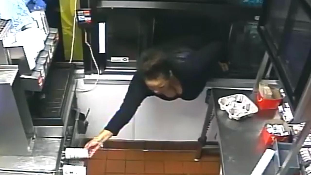 Woman climbs through drive-thru window to steal food, cash