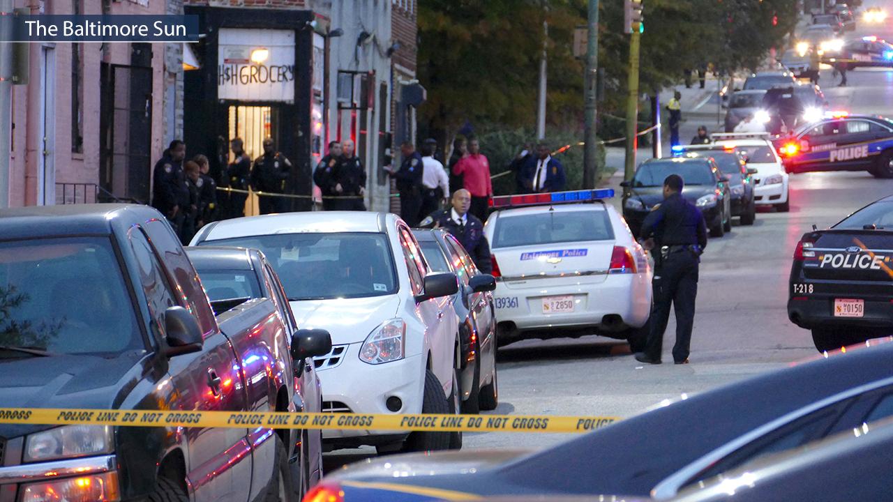 Manhunt for gunman after Baltimore detective shot in head