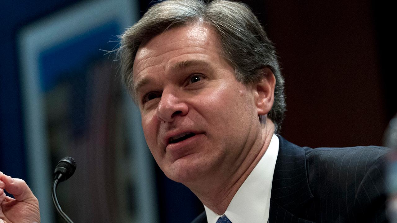 FBI's Wray questioned on handling of Clinton email probe