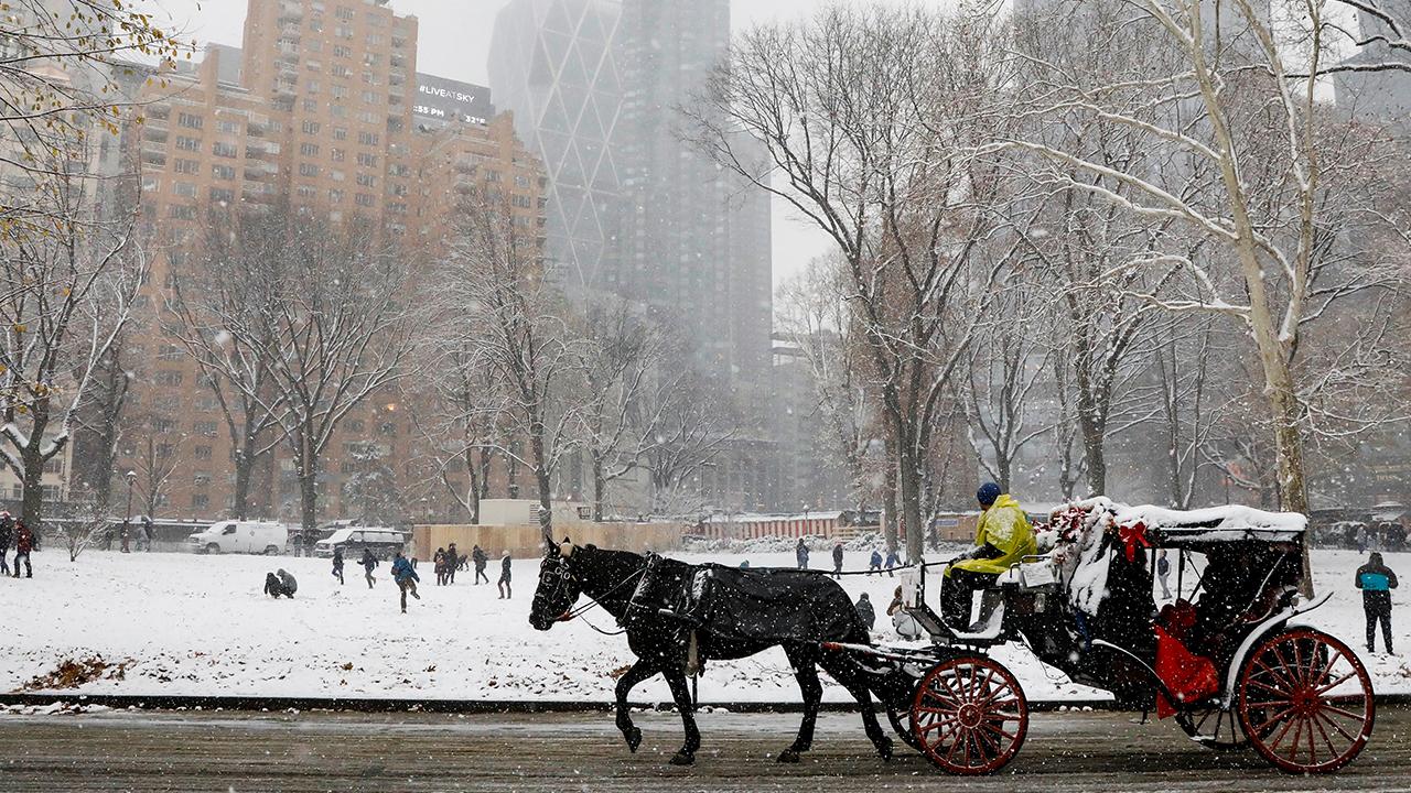 NYC shoppers greeted with first snow of the season