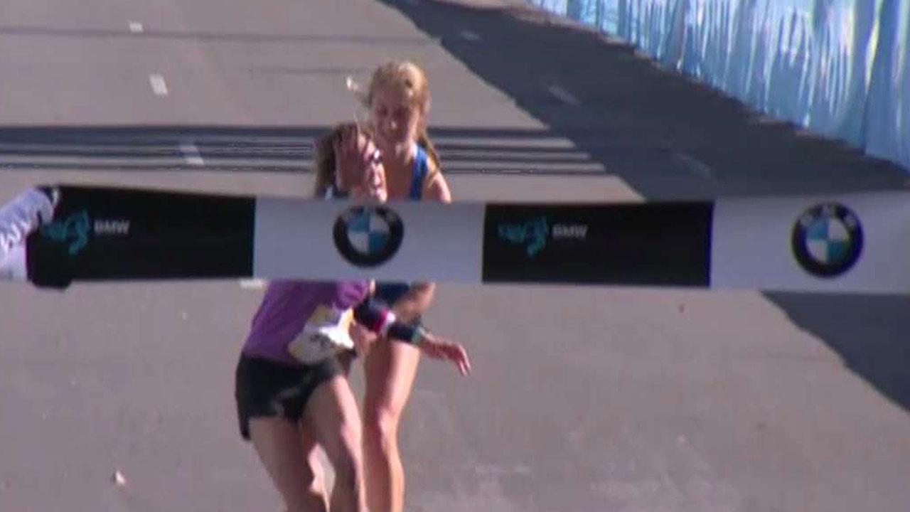Teen helps collapsing marathon winner across finish line