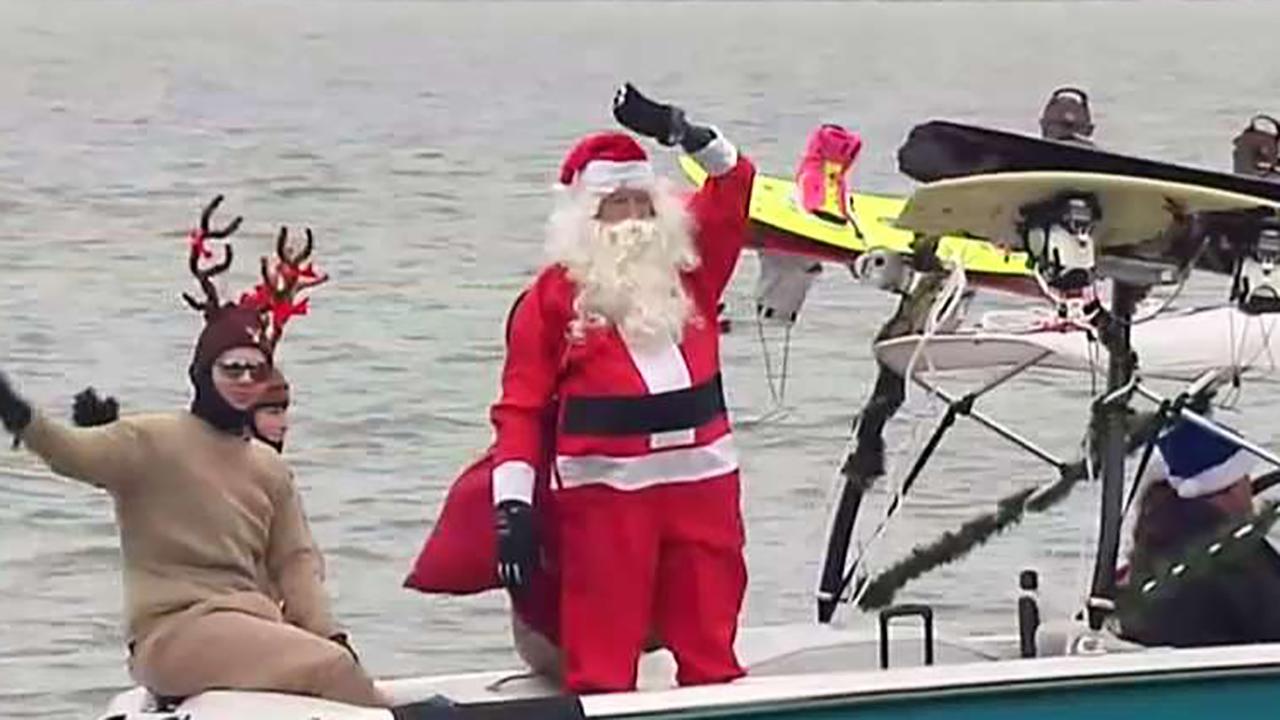 Santa and the Grinch waterski down the Potomac River