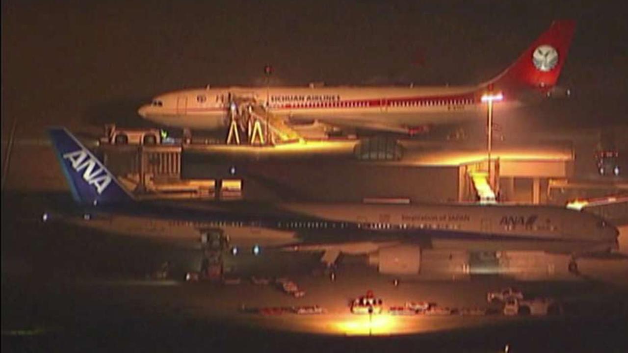 Tokyo-bound jet returns to US over 'unauthorized' passenger