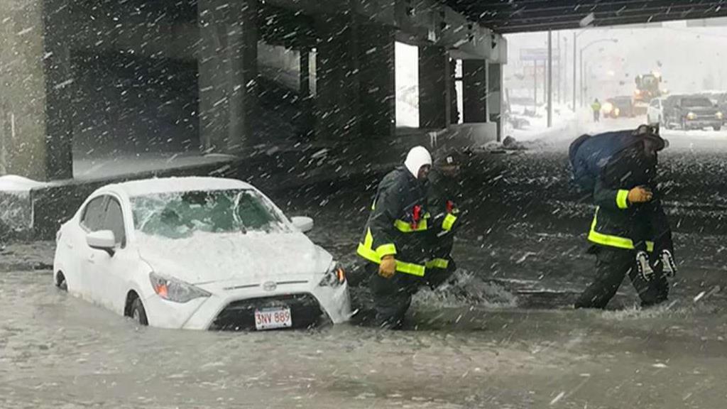 Boston battles flood waters after 'bomb cyclone'