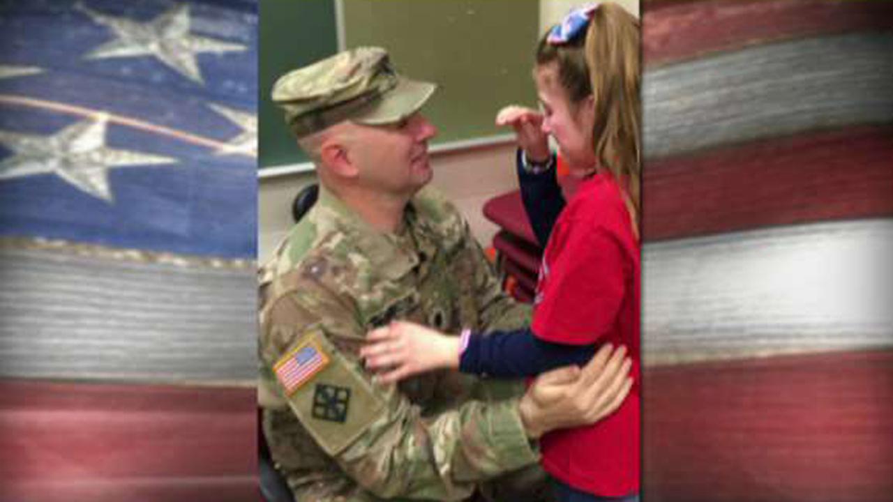 Deployed dad surprises daughter at school