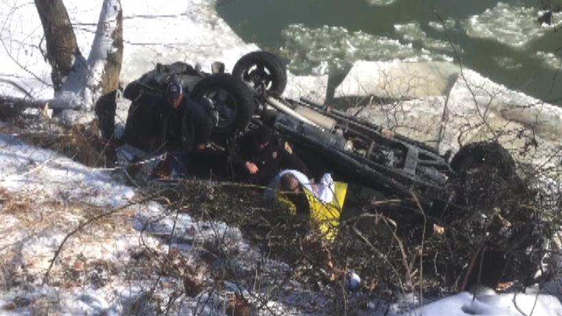 66-year-old man rescued after truck flipped into river