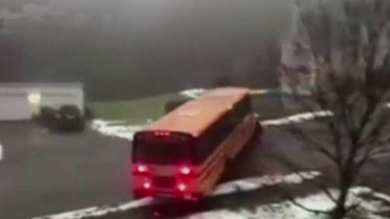 School bus slides backwards down icy street in Massachusetts