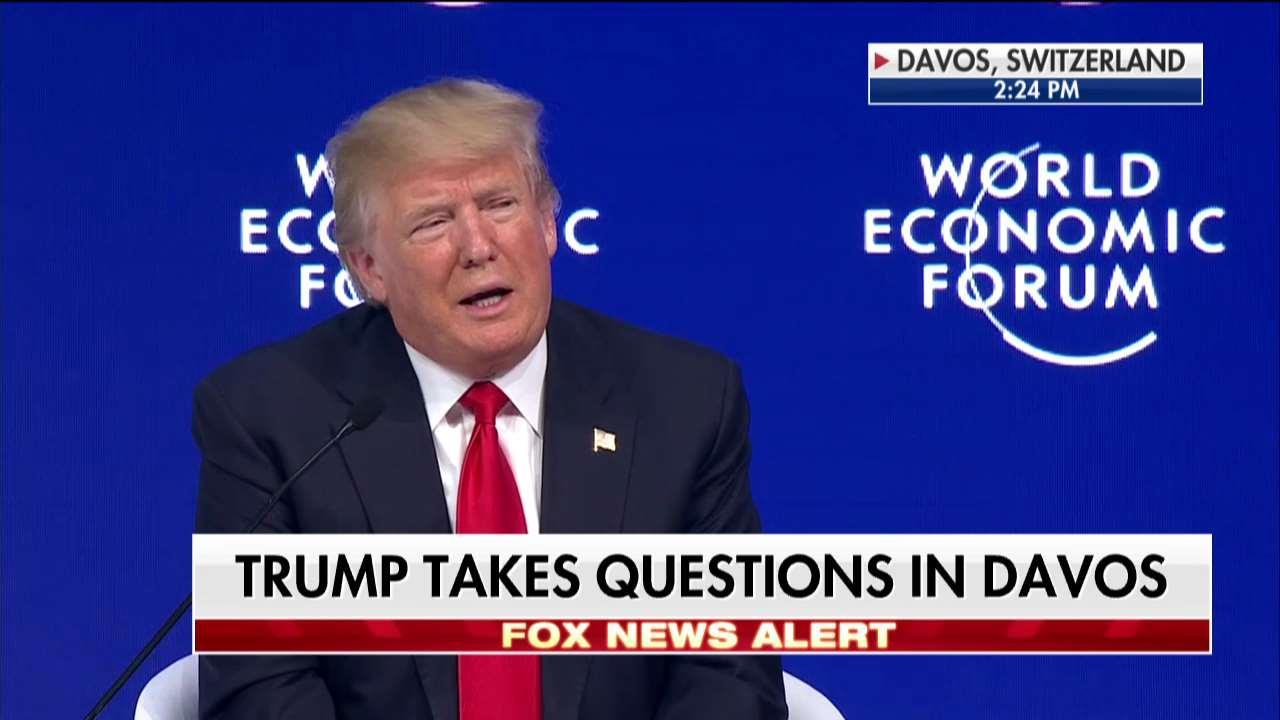 Trump takes questions at Davos forum.