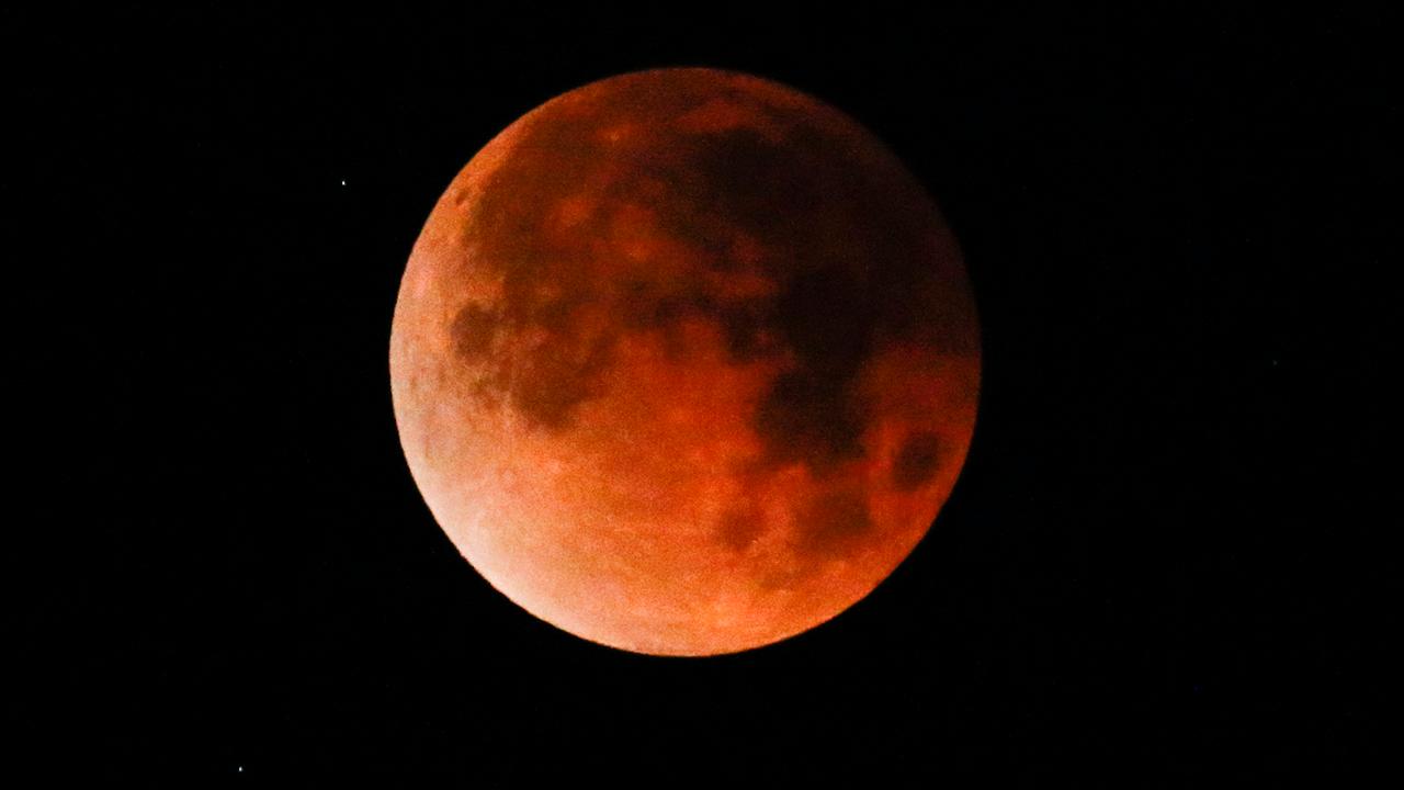Super blue blood moon delights skywatchers across the US