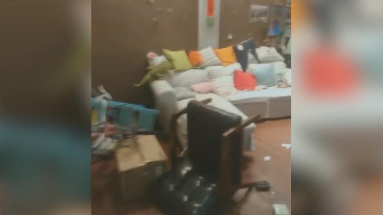 Resident surveys damage in hostel after Taiwan earthquake