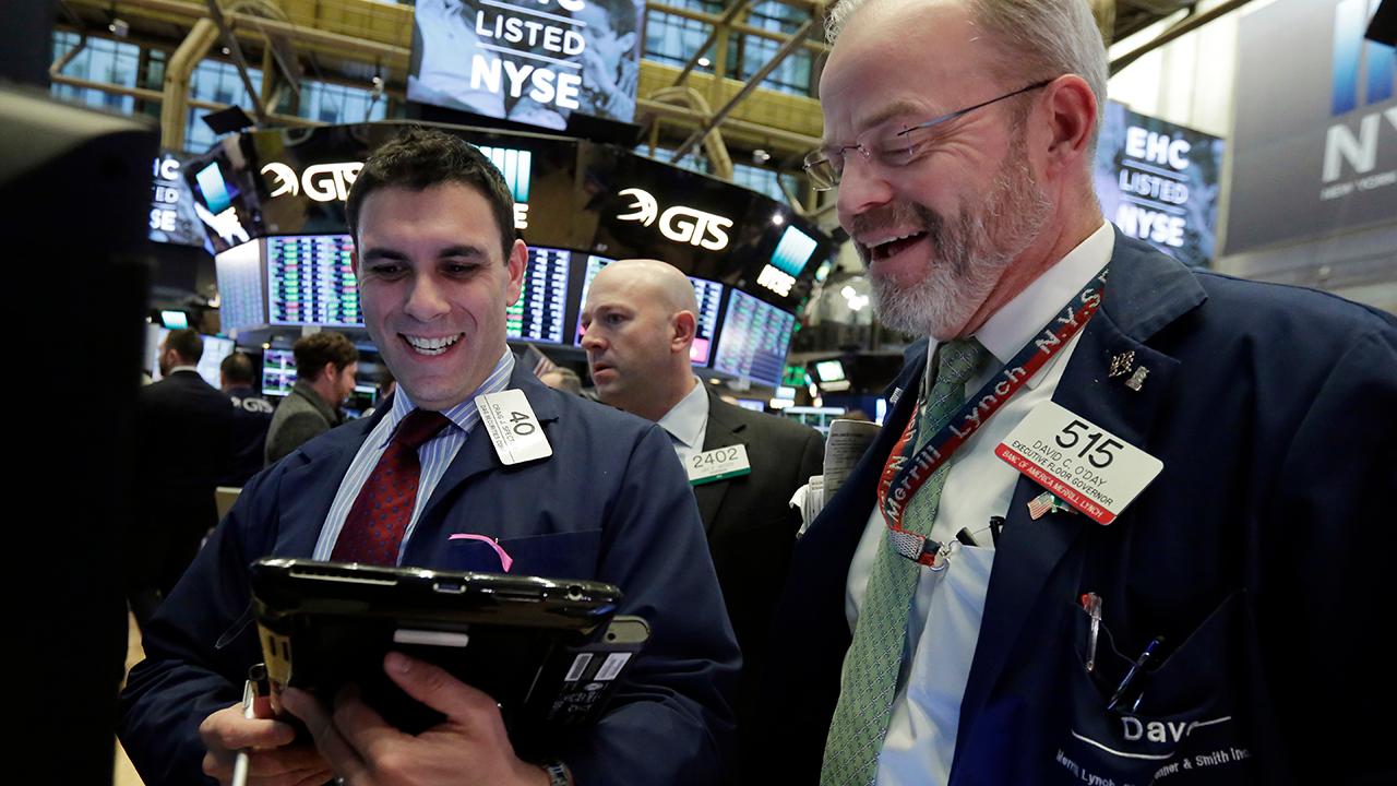 Wall Street erases Monday's losses with a late day rally