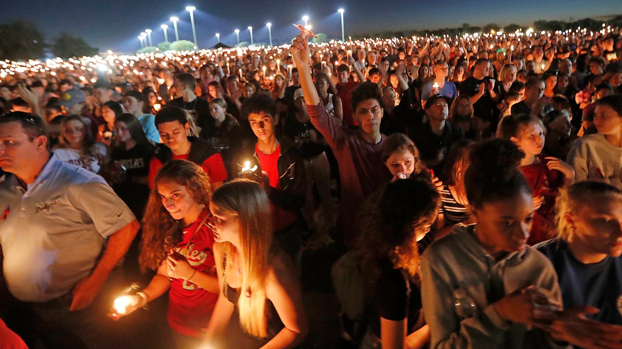 Parkland, Florida community holds a candle light vigil