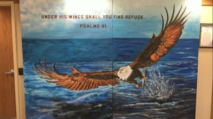Atheists want Bible verse mural scrubbed