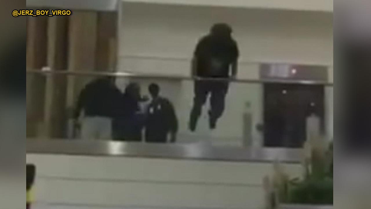 Shocking video Man jumps over railing at Atlanta airport Fox News Video