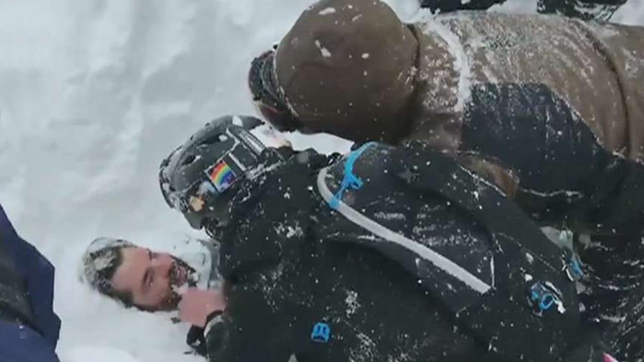 Snowboarder rescued from avalanche in California