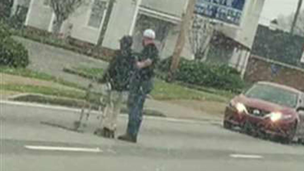 Driver stops to help elderly man cross the street