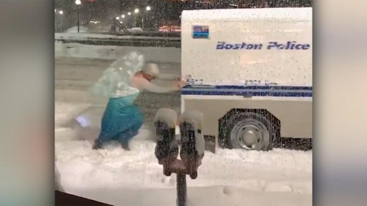 Man dressed as Disney's Elsa frees police van from snowbank