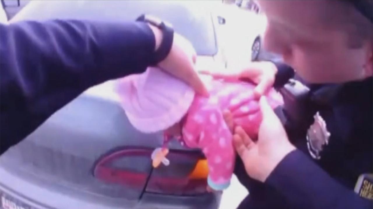 Quick-thinking police officers save choking baby