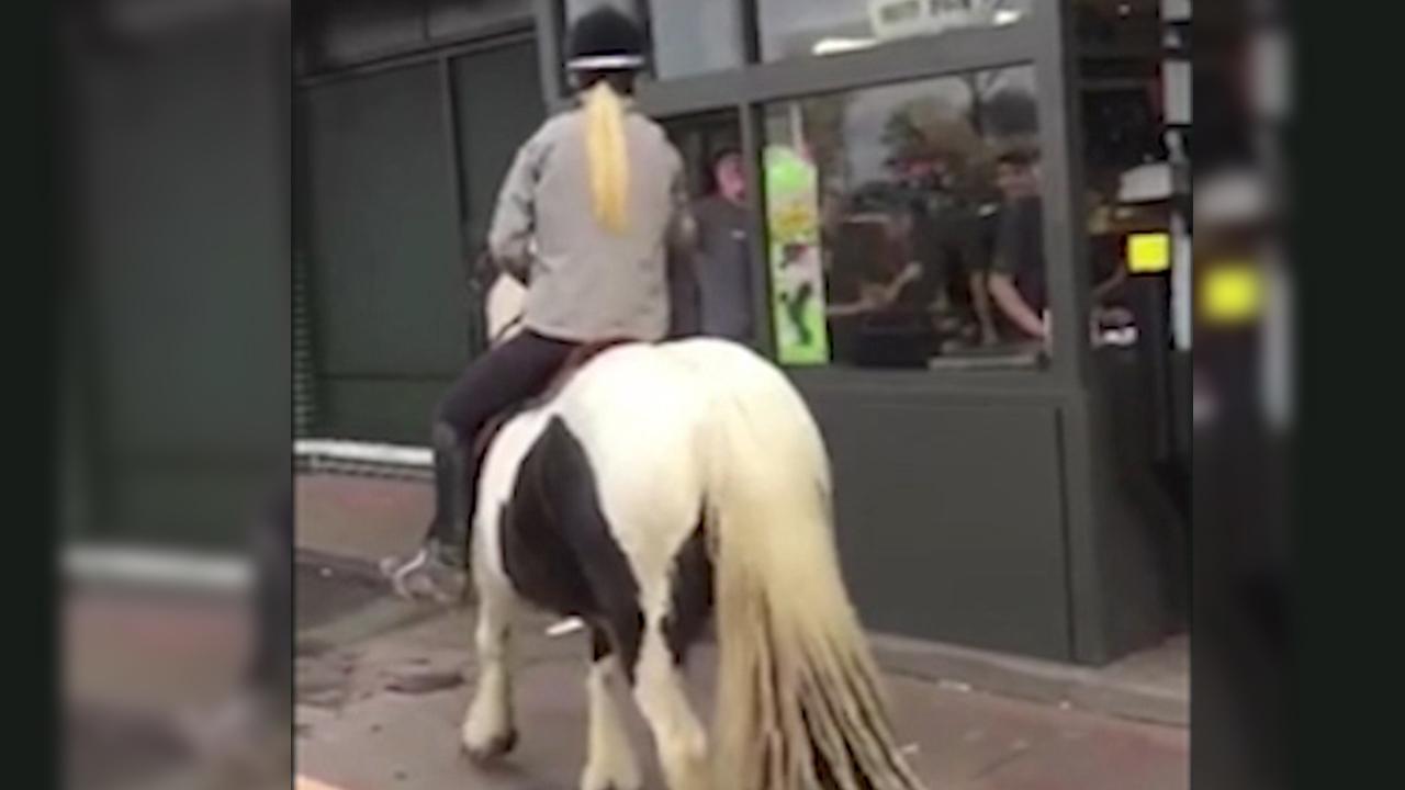 Watch: English teen rides horse through McDonald's drive-thru