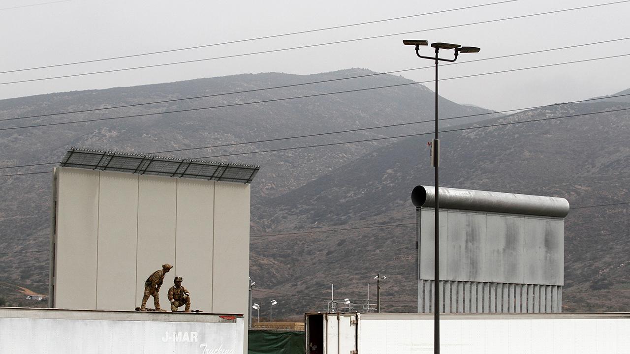 Does migrant caravan justify building a wall?