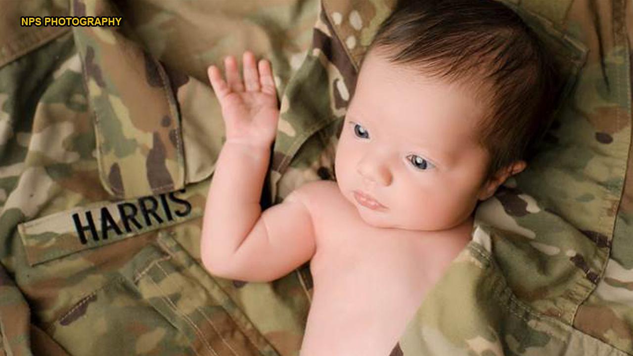 Baby poses in her late father's military uniform