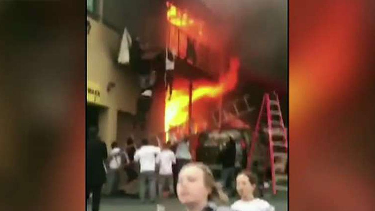Kids jump from balcony to escape fire