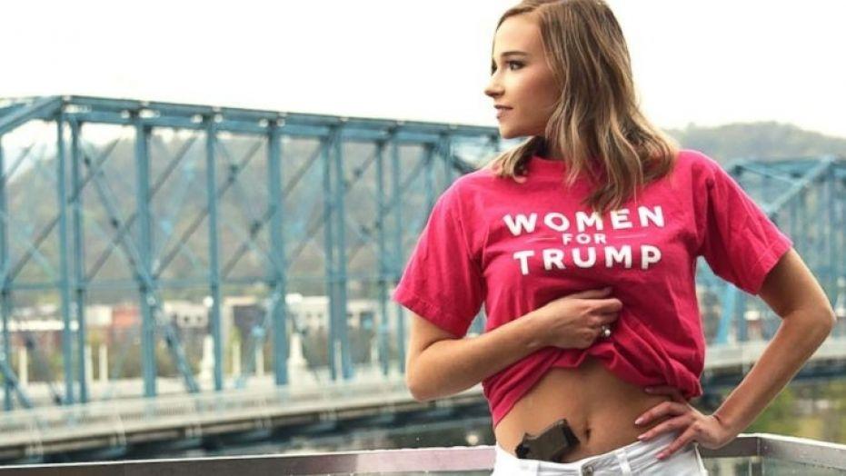 College senior poses for graduation picture with a gun in her waistband
