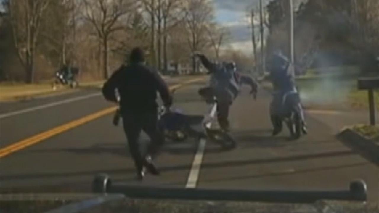 Dirt biker falls off motorcycle, hops on another to flee cop