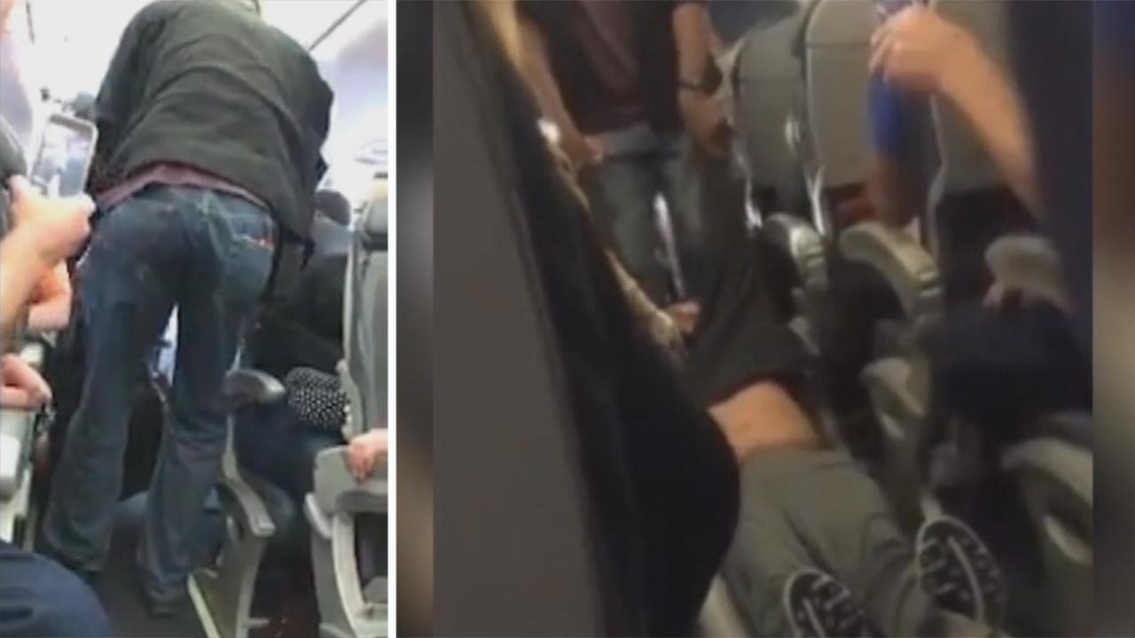 Officer who dragged passenger off flight sues United