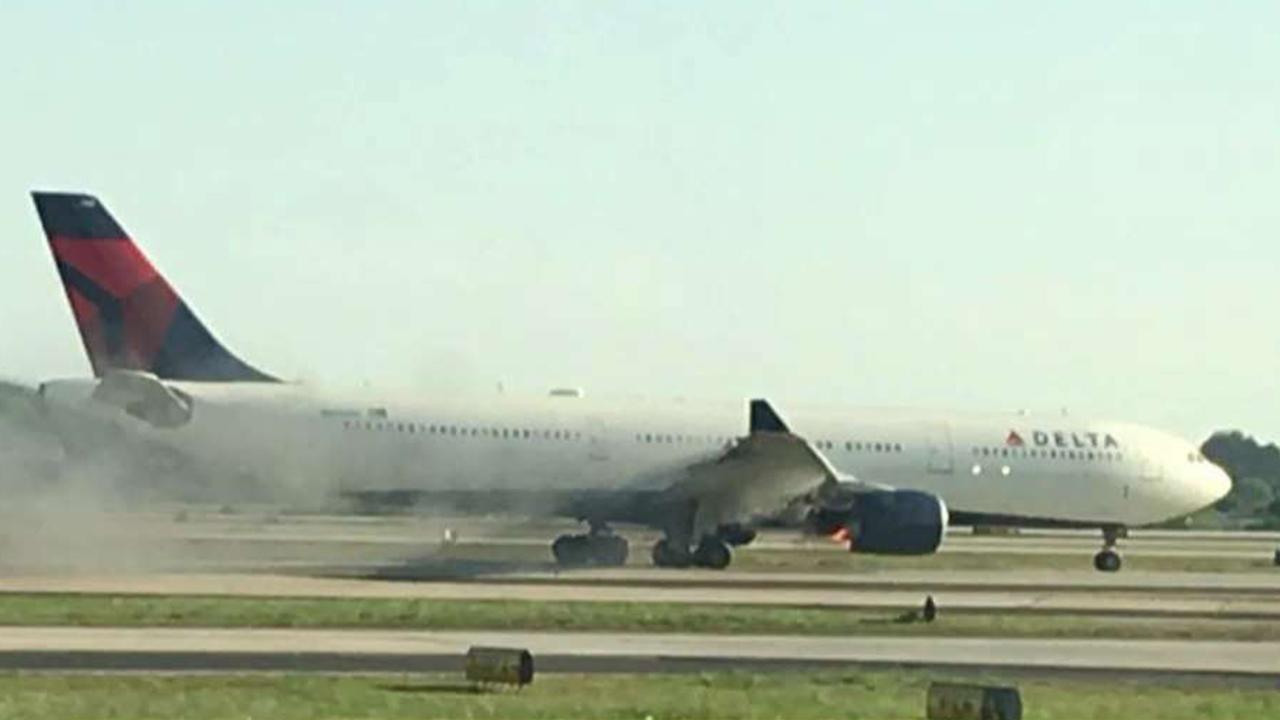 Video shows smoke billowing from Delta plane