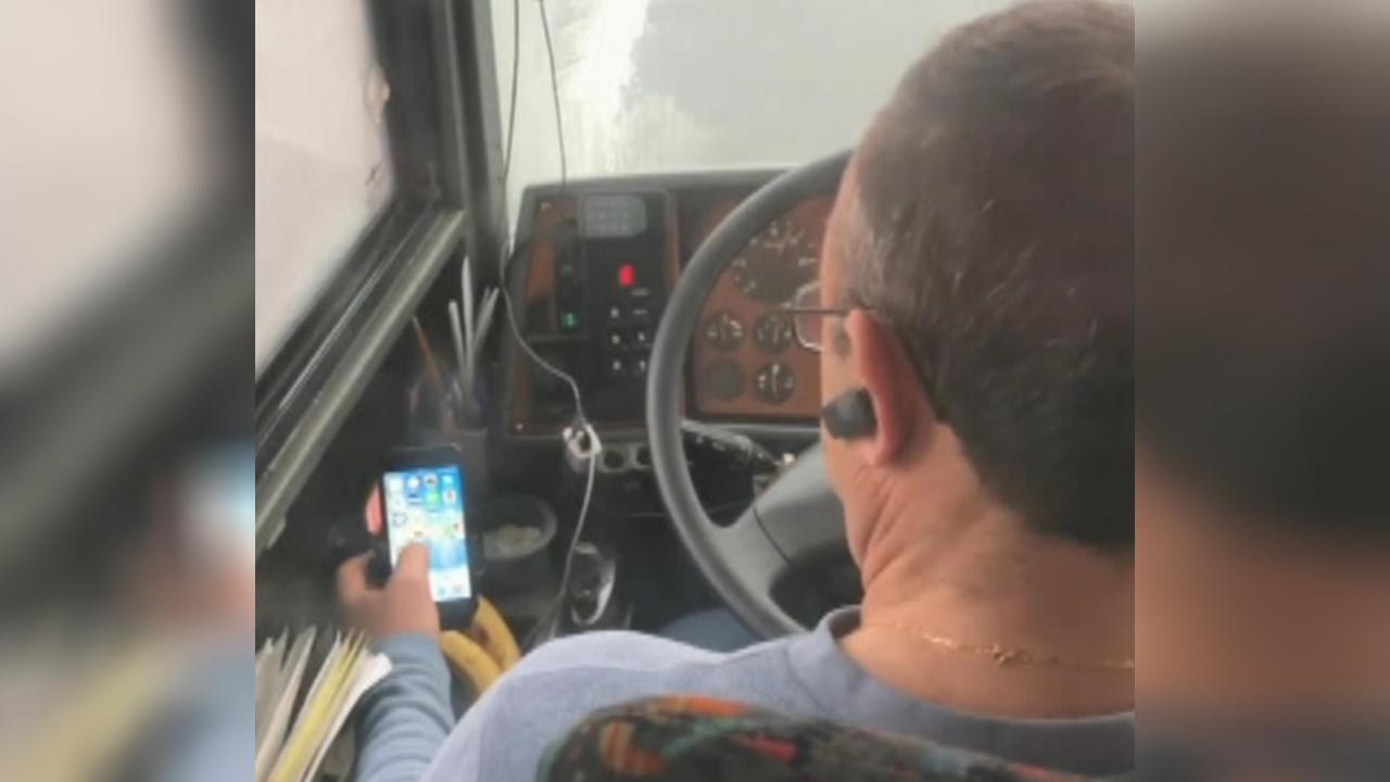 Bus driver caught watching videos on his phone while driving