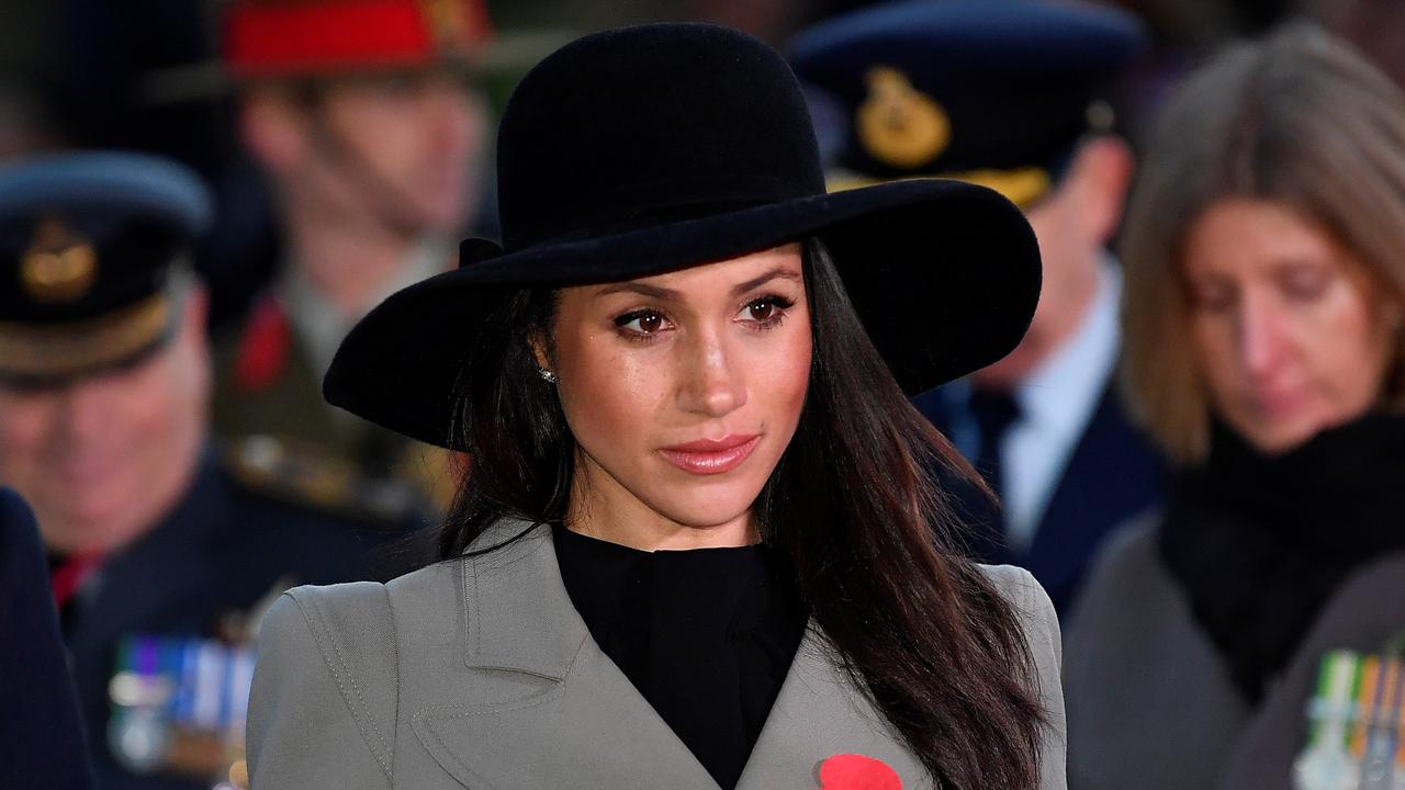 Meghan Markle sports trench coat after dress controversy