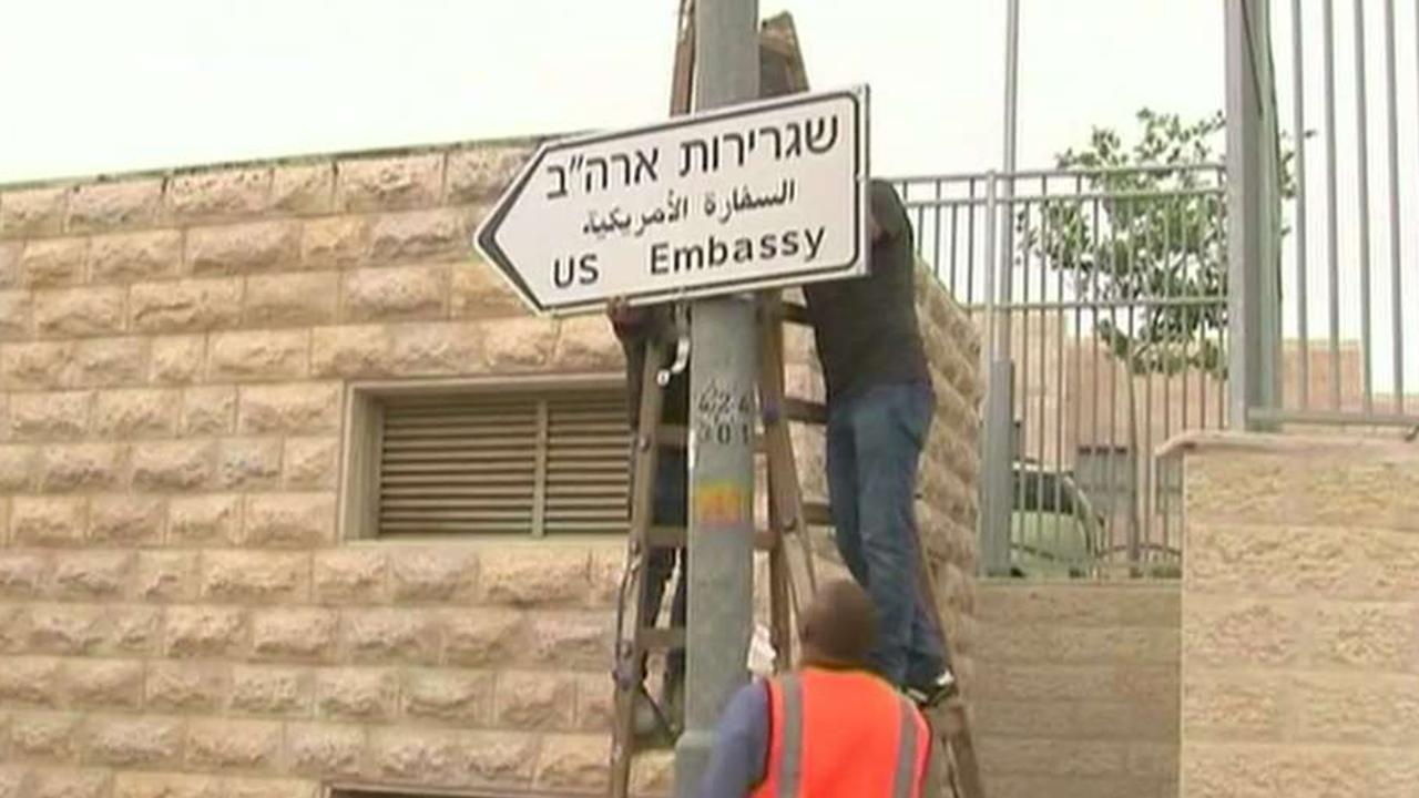 Officials in Jerusalem put up road signs for new US embassy