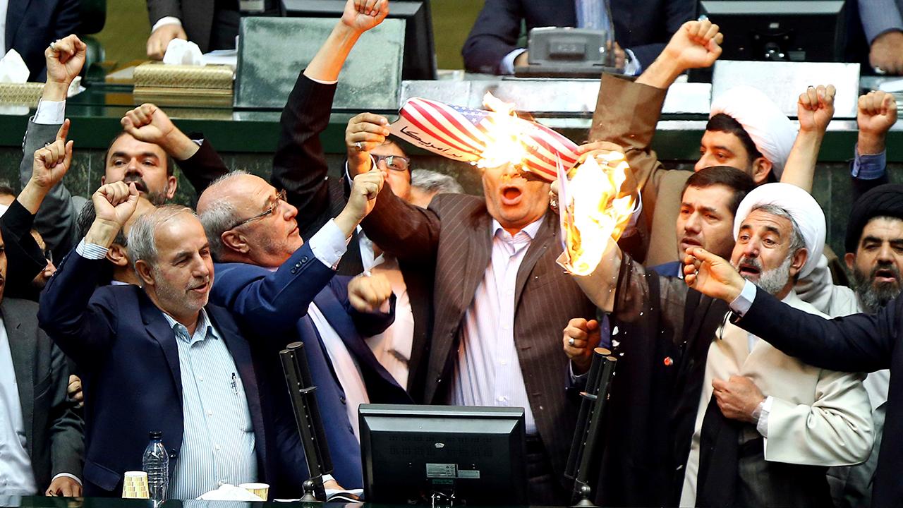 Iranian lawmakers burn US flag after Trump nuclear deal exit