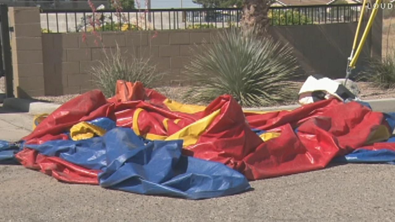 Bounce house blows away with child inside
