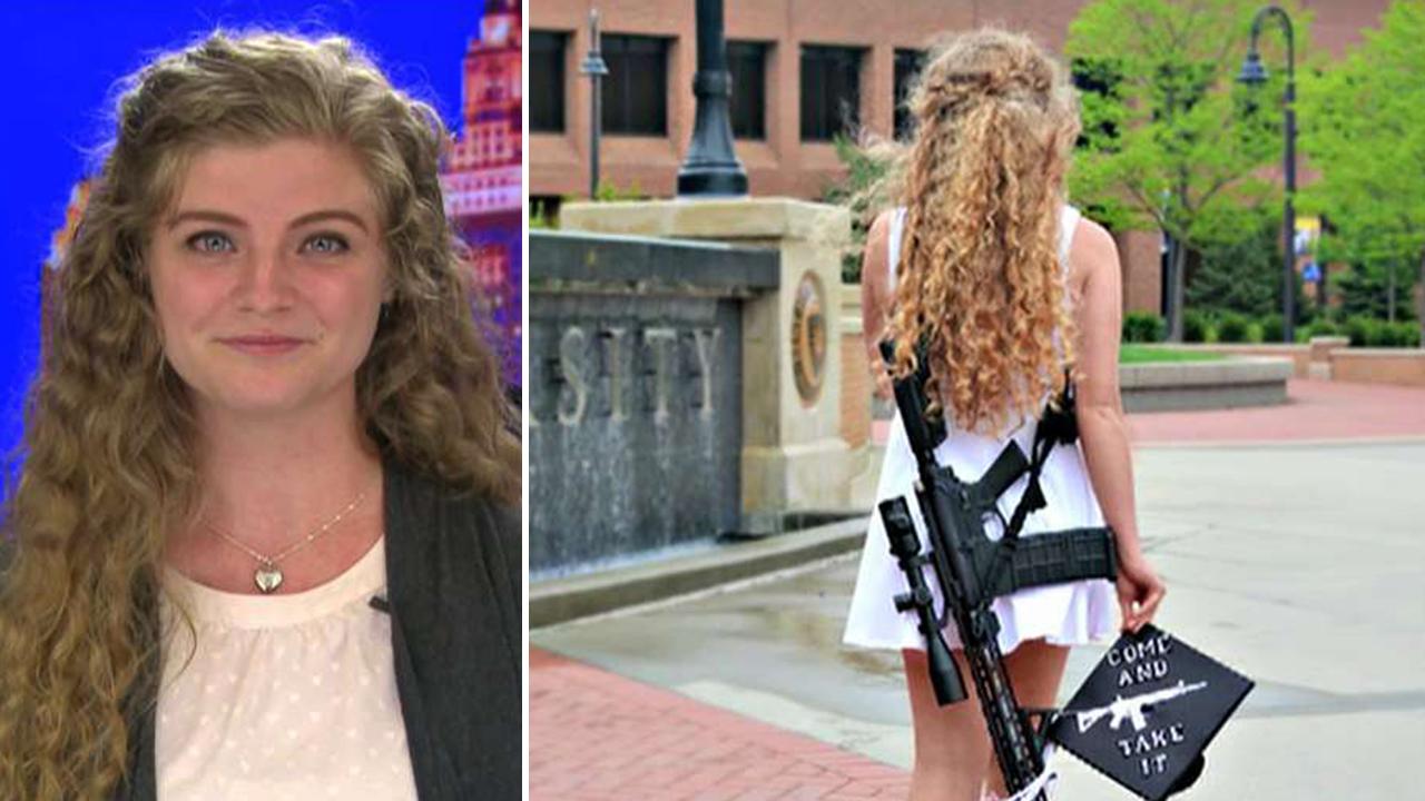 Kent State graduate poses with rifle on campus