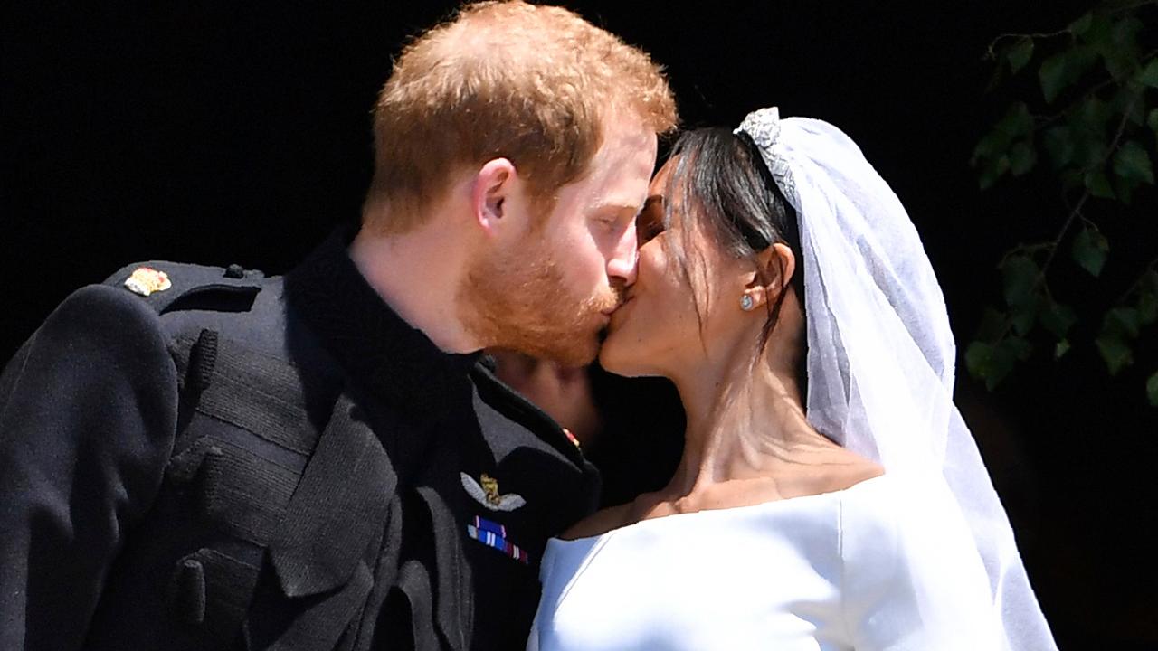 Prince Harry, Meghan Markle seal royal wedding with a kiss