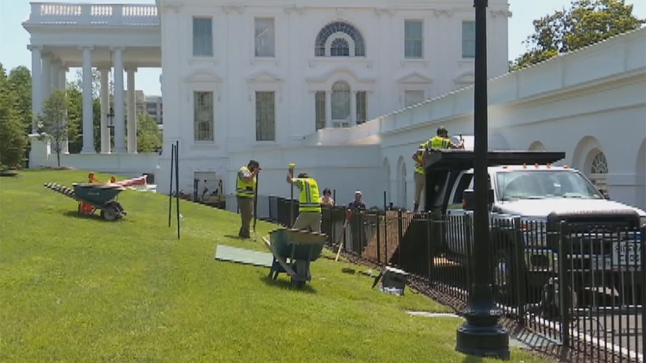 Crew works to fill in White House sinkhole