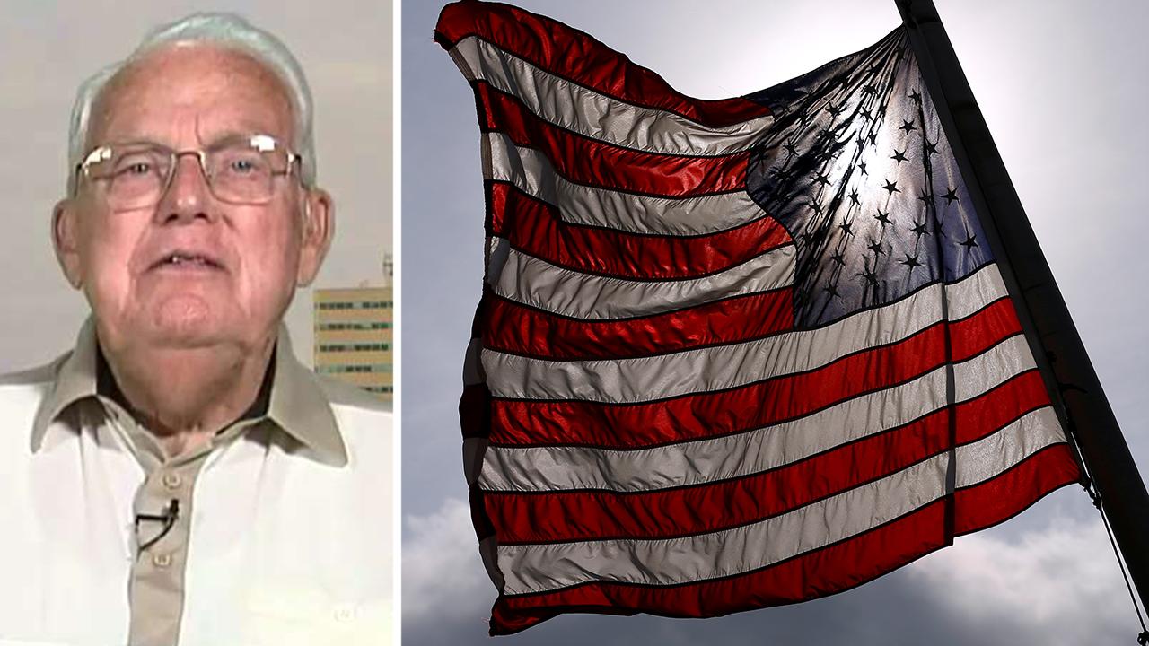 Korean War veteran fights to keep American flag flying