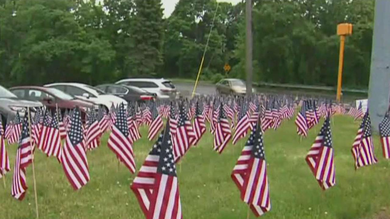 City tells business to remove 'excessive' American flags