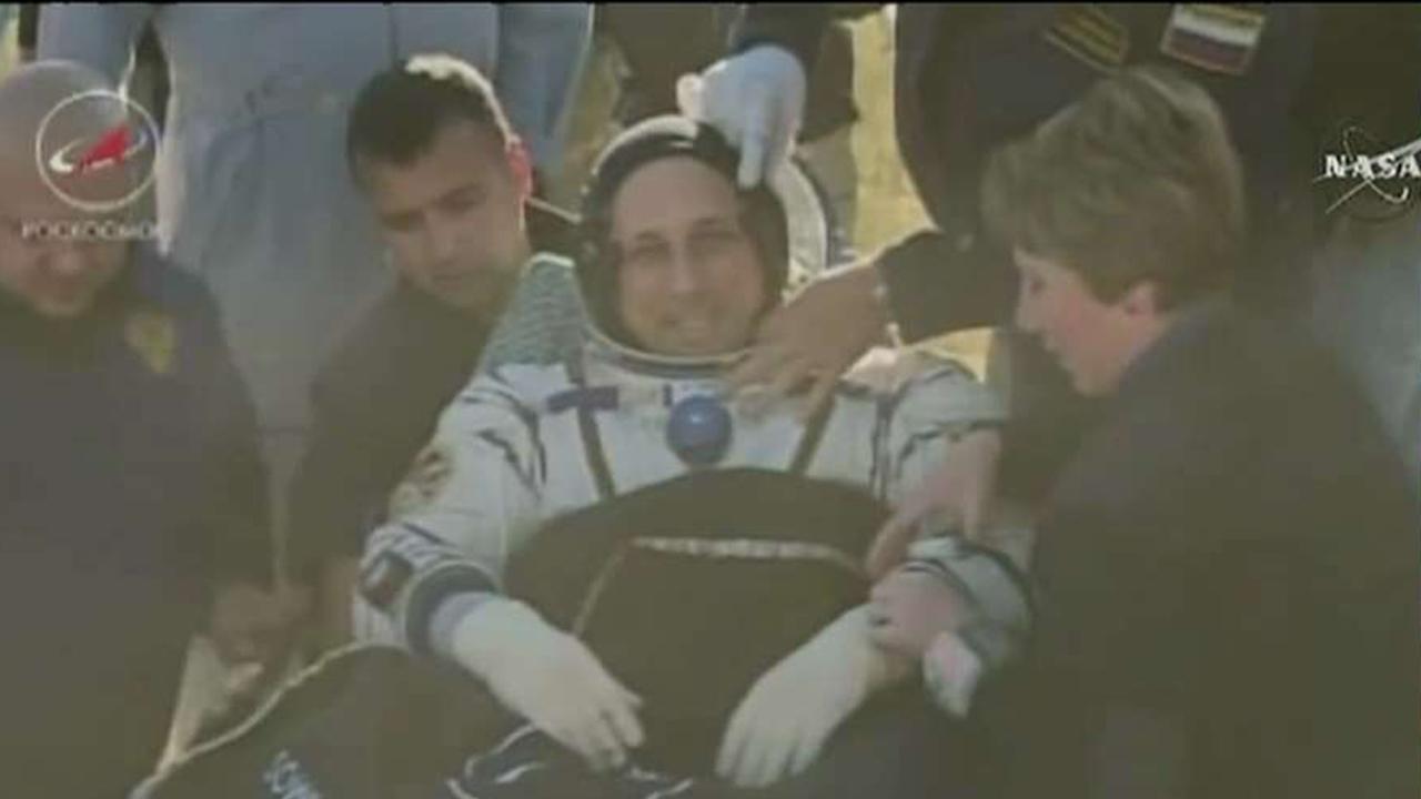 Three astronauts return home from the ISS