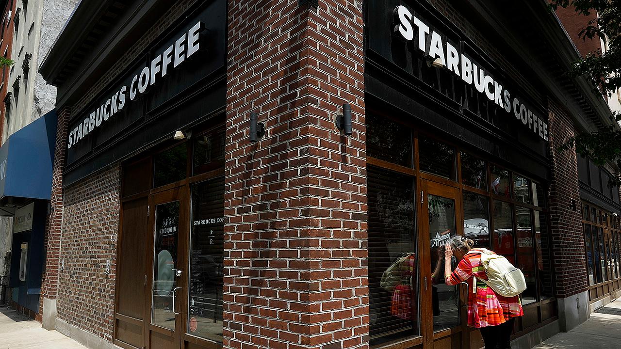 Starbucks head blames Trump for race tensions