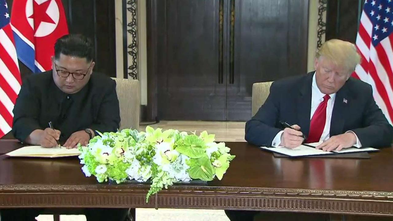 Trump and Kim sign 'comprehensive' document
